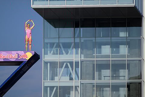 Red Bull Cliff Diving World Series: Molly Carlson of Canada acknowledges the crowd from the 21 metre platform